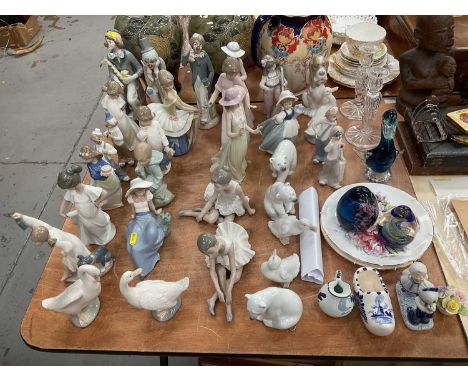 Quantity of Lladro, Nao, and Cascades figures, including polar bears, clowns, etc, together with Delft, Coalport and other ch