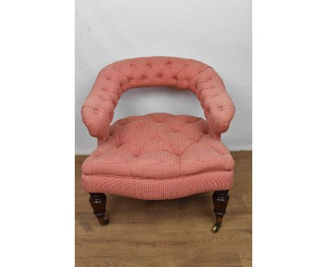 Mid 19th century button upholstered tub chair, with bar back, raised on turned legs and castors