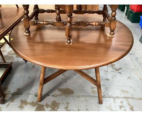 Ercol elm oval drop leaf table on square legs joined by x frame stretchers, opening to 112cm x 124cm, together with a set of 