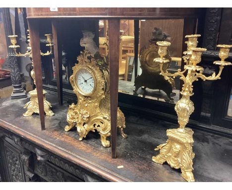 Gilt mantel clock with gilt candelabra together with pendulum and key