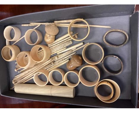 Selection of bone and celluloid items including napkin rings together with a carved walking stick and three parasols
