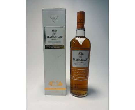 A bottle of The Macallan Amber Highland Single Malt Scotch Whisky, ‘Exclusively matured in sherry oak casks from Jerez, Spain