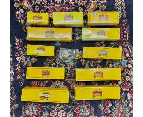 A collection of 11 boxed Atlas editions Greatest Show on Earth models, along with a key ring and a tin of drinks mat's