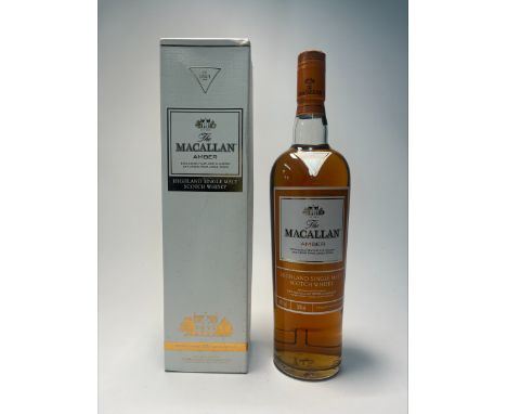 A bottle of The Macallan Amber Highland Single Malt Scotch Whisky, ‘Exclusively matured in sherry oak casks from Jerez, Spain