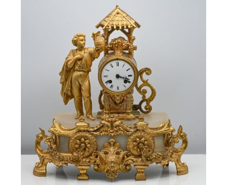 A 19th century French gilt metal and alabaster figure mantle clock, height 43cm.