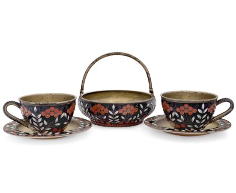 A pair of Soviet 'Rowan berry' pattern enamelled cups and saucers by the Leningrad Jewellery Factory, Leningrad (St. Petersbu