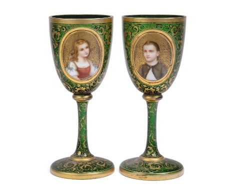 A pair of Bohemian green glass goblets, late 19th century, one with an oval plaque with hand-painted portrait of a young girl