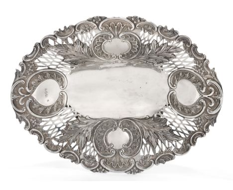 A pierced Victorian silver dish, London, 1892, Edward Hutton, of oval form with shaped scroll border and repousse floral and 
