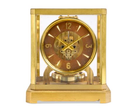 A Jaeger-LeCoultre Atmos clock, c.1950s, with brushed brass case, the circular chapter ring with alternating Arabic numerals 