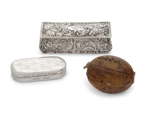 A novelty travelling inkwell in the form of a rugby ball, with stitching detail to leather cover, the lid opening to reveal a