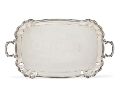 A Peruvian tray by Camusso, Lima, c.1950, stamped 925, of rectangular form with shaped corners and twin scroll handles, appro