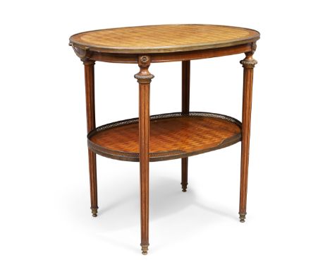 A French parquetry inlaid two tier oval etagere, in the Louis XVI style, first quarter 20th century, gilt metal mounted, the 