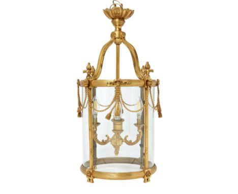 A gilt-brass brass cylindrical hall lantern, of George III style, second half 20th century, applied with beaded and ribbon-ti