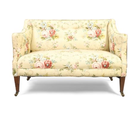 An Edwardian mahogany framed two seat sofa, in the George III style, first quarter 20th century,&nbsp;with classical floral u