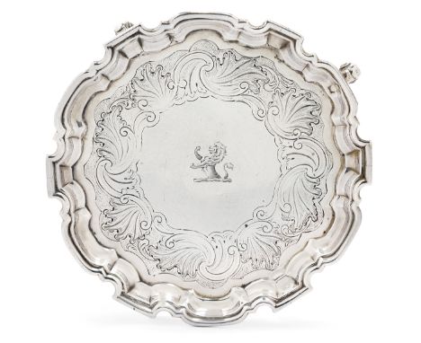 A George II silver waiter, London, 1732, probably John Tuite (mark indistinct), raised on four scroll feet, the waiter design