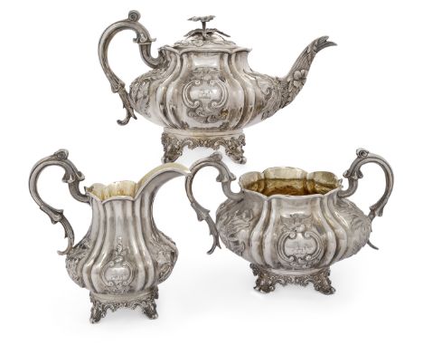 A Victorian three piece silver tea set, London, 1840, John & Henry Lias, of lobed, compressed form with applied floral and fo