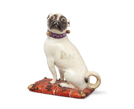 A Meissen model of a pug bitch, c.1745-50, modelled by J.J. Kändler, seated on her haunches with her head turned to her left,