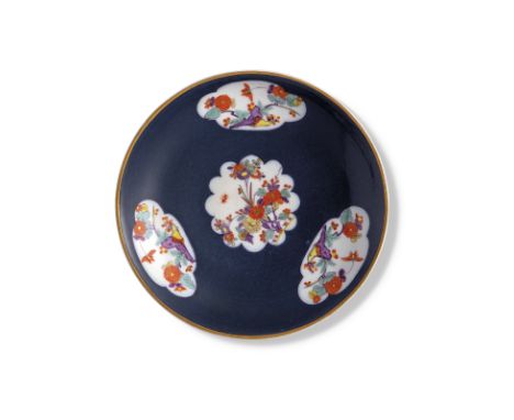 A Meissen porcelain blue-ground Kakiemon saucer-dish, probably 19th century, blue crossed swords mark, reserved with three qu