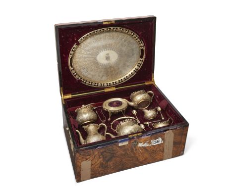A Victorian silver gilt tea service in velvet-lined wooden chest, London, 1882, Martin, Hall & Co., the tray Sheffield (same 