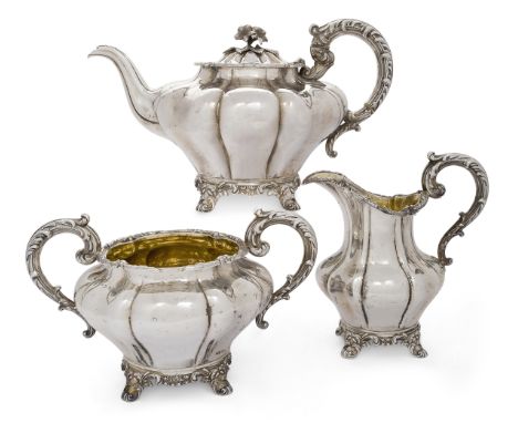 A Victorian three piece silver tea set, Newcastle, 1840, John Walton, the melon-shaped teapot, sugar and milk jug designed wi