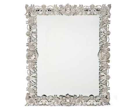 A Victorian silver framed mirror, London,1881, Robert Humphries, of rectangular form, the openwork frame designed with winged