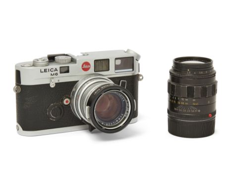 A Leica M6 35mm rangefinder camera, 1992, chrome, serial no. 1931932, held in original packaging, with camera strap in separa