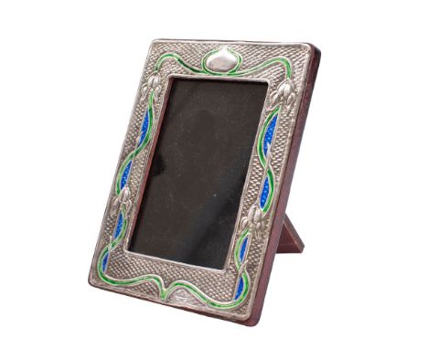 A sterling silver and enamel photo frame, stamped Sterling in the Art Nouveau taste, of rectangular outline decorated with si