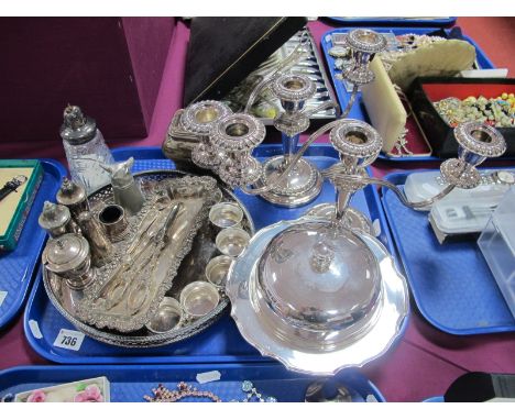 A Pair of Twin Branch Candelabra, grape scissors, napkin rings, muffin dish, XIX Century plated caddy of shaped form with rec