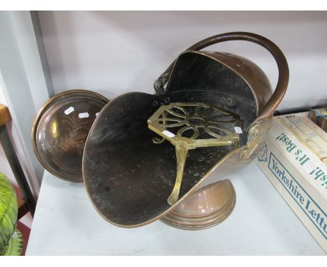 XIX Century Copper 'Helmet' Shaped Coal Scuttle; together with a XIX Century copper warming pan and a brass trivet. (3)