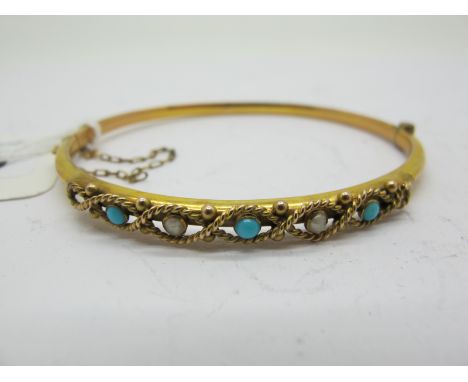A Chester Hallmarked 9ct Gold Turquoise Set Bangle, hinged to snap clasp (internal diameter 6cm). 
