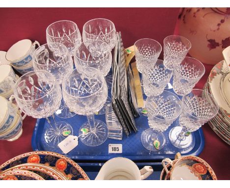 A Set of Six Waterford Crystal 'Lismore' Pattern Hock Glasses, raised on circular star cut bases, 18.5cm high; A Set of Six W