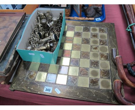 Chess Set, of thirty two gilded pieces, as medieval figures, the kings, 10cm high, with board.