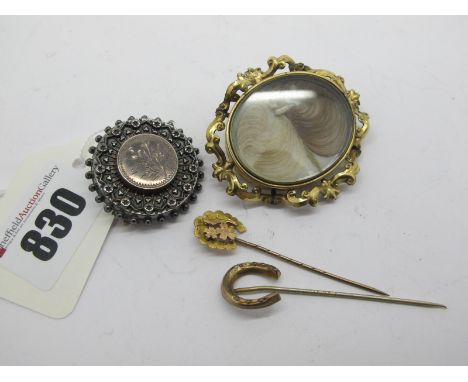 A XIX Century Hairwork Locket Brooch, the central oval glazed panel within scroll border; together with two stickpins and a f