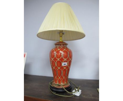 A Modern Ceramic Table Lamp, the baluster burnt orange ground with cream/gilt decoration, on a hardwood stand, 64cm high (wit