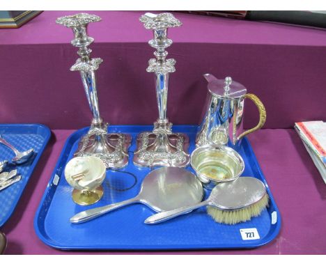 A Chester Hallmarked Silver Backed Hand Mirror and Hairbrush, engine turned, together with a pair of plated on copper candles
