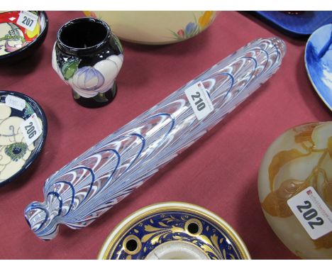 A Late XIX Century Glass Nailsea Rolling Pin, decorated in trailing white and blue scrolls, 34cm long.