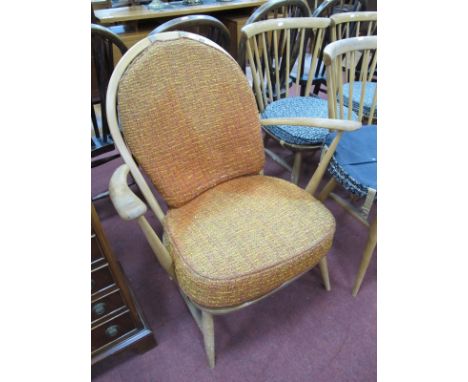 Ercol Low Easy Chair, with spindle back, on square splayed legs, bearing label.