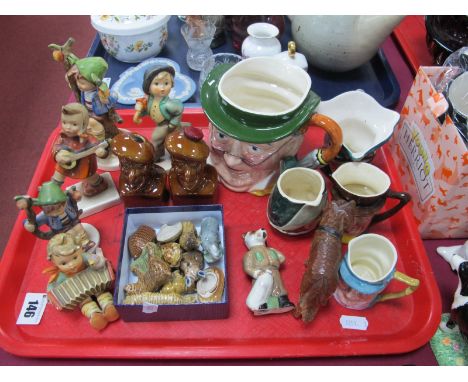 Five Hummel Pottery Figures, (damaged), Wade Whimsies, Military Dog, carved wooden St. Bernard character jugs:- One Tray 