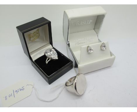 A Large Pear Shape Single Stone Dress Ring, (finger size P1/2); together with a pair of pear shape earrings stamped "925" and