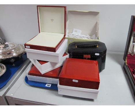A Modern Dulwich Designs Jewellery Case, a quantity of fabric jewellery pouches and four multi ring jewellery boxes (empty).