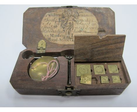 An Andrew Yeatman Cased Set of Gold Scales with Weights (one missing), in a fitted wooden box, label to the lid.