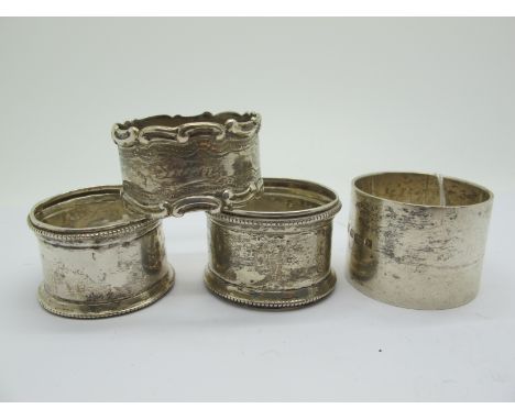 A Hallmarked Silver Napkin Ring, initialled and dated "P 1923", a pair of hallmarked silver napkin rings (initialled) and ano