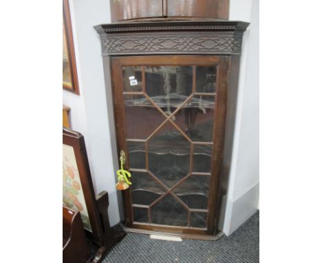 Mahogany Wall Hanging Corner Cupboard, with dentil cornice, blind fretwork panel, over astragal door fronting three shaped sh