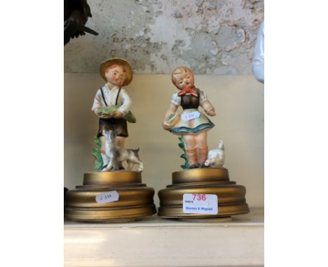 TWO HUMMEL FIGURES ON MUSICAL BASESCONDITION: BOTH MUSICAL BOXES IN WORKING ORDER. MARKS TO BASES AS PICTURED. ONE DAMAGED AN
