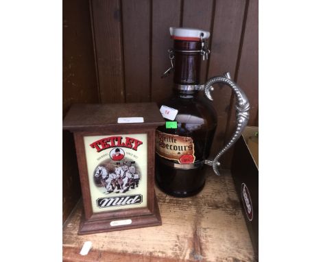 A TETLEY MILD LIGHT BOX AND A 2L LIQUOR BOTTLE (EMPTY)
