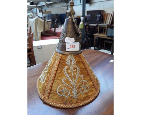 A HANGING LIGHT SHADE(?)