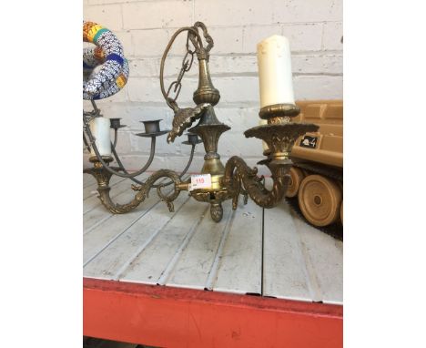 A BRASS CHANDELIER LIGHT FITTING