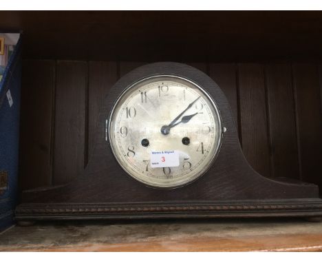 A MANTLE CLOCK
