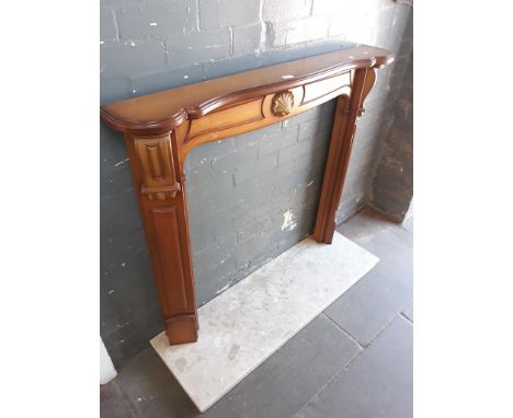 A WOODEN FIRE SURROUND AND MARBLE HEARTH