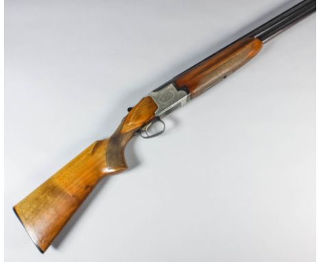 A 12 bore over and under shotgun by Winchester model 91, Serial No. 220285, the 28ins blued steel barrels with engine turned 